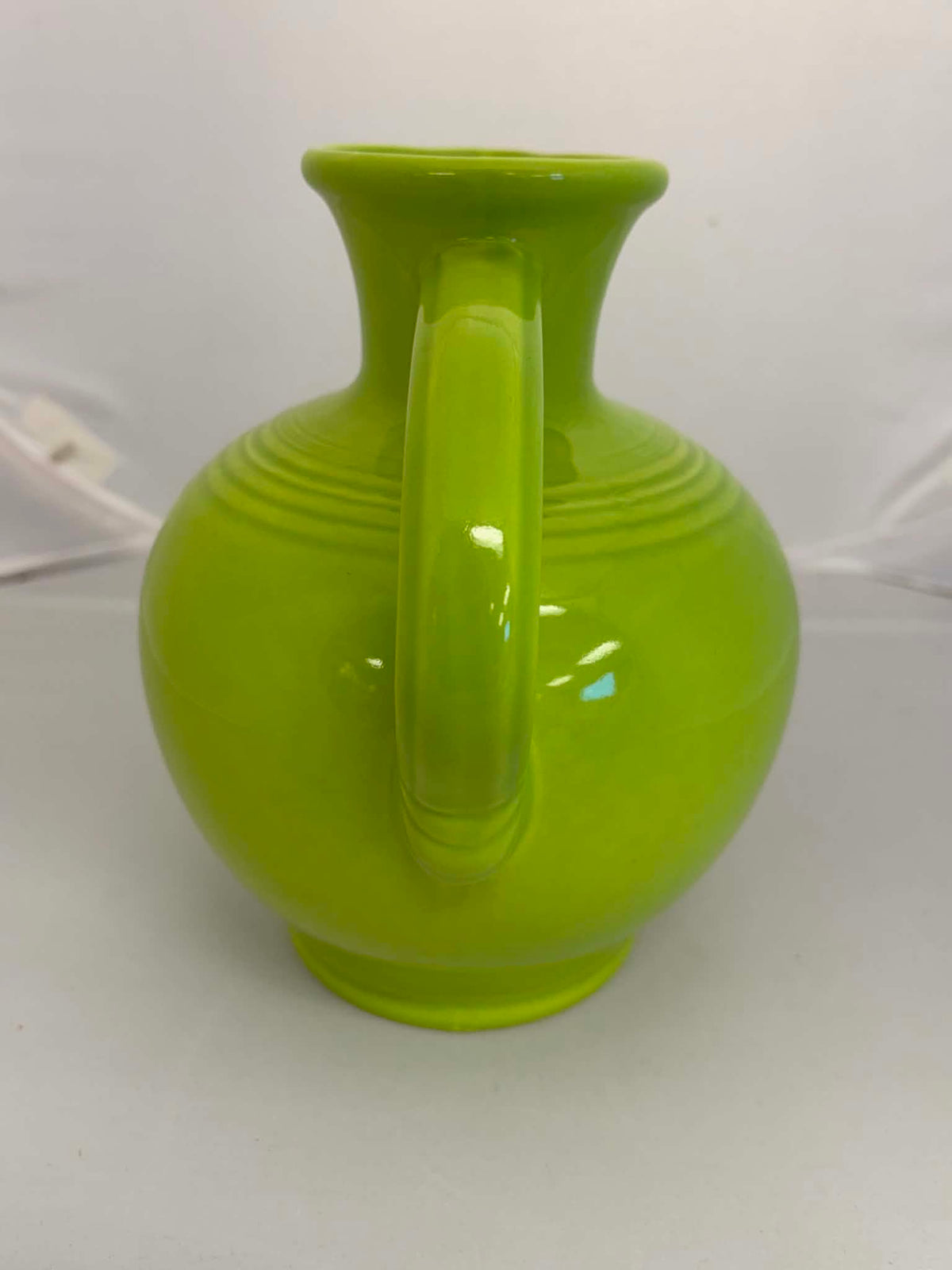 This is a Fiesta Fiestware small 60 Ounce Carafe in chartreuse. Lead-free Post 1986 Retired color retired shape

