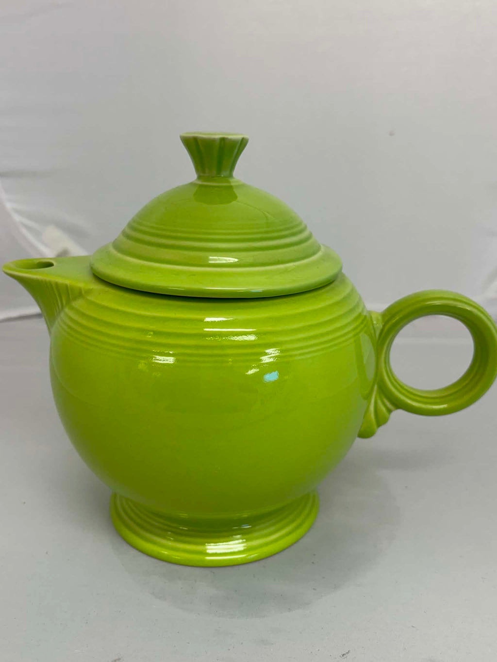 This is a Fiesta Fiestaware Five-cup 5-cup Ring Handled Tea Pot with Lid in Chartreuse. lead-free, Post 1986, Retired Color Retired Shape
