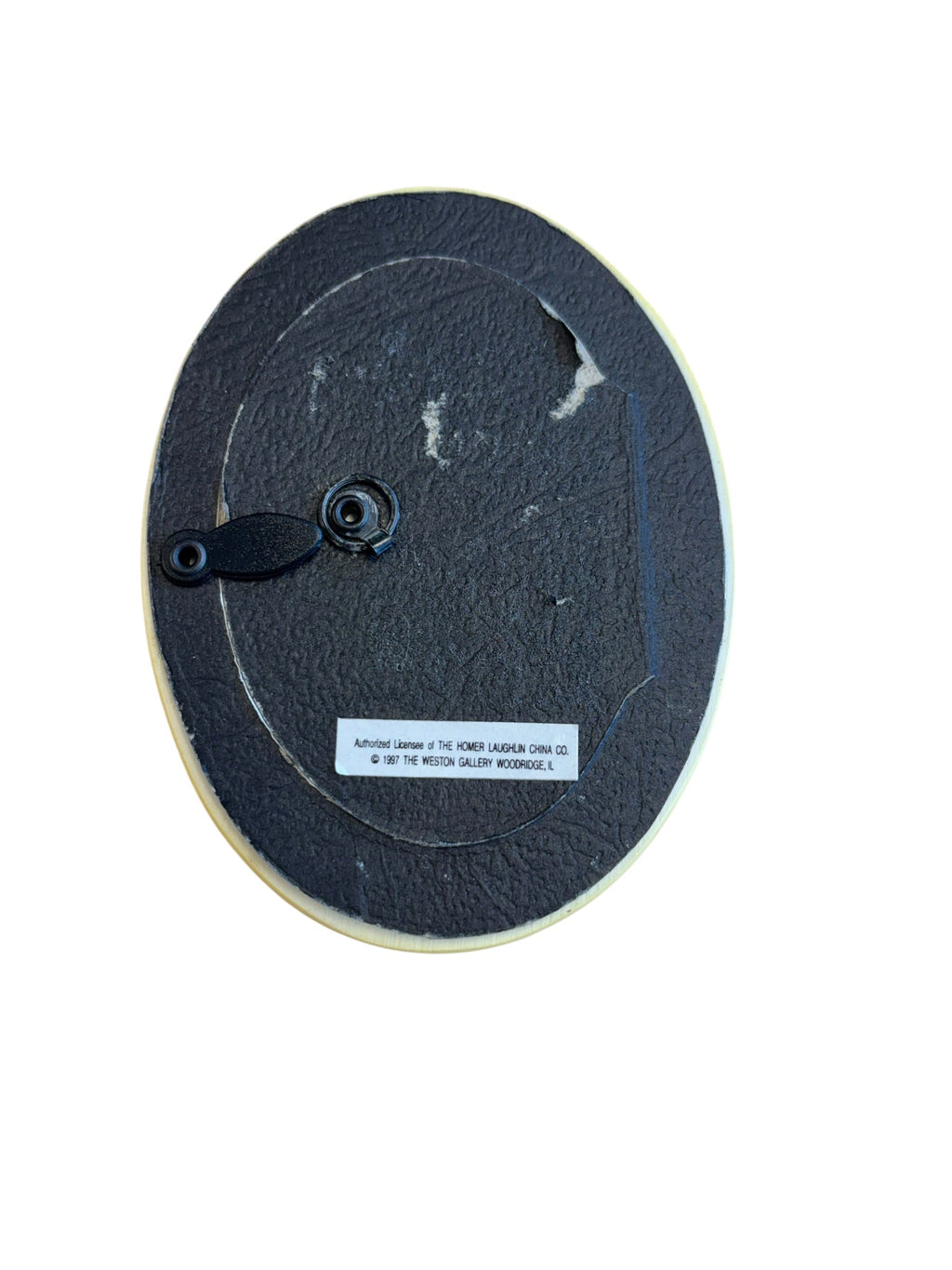 Back view of One Piece At A Time Fiesta Weston Gallery yellow oval picture frame with black backing and stand